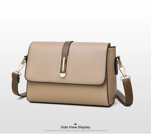 Detail view of khaki square shoulder bag with gold buckle and adjustable strap