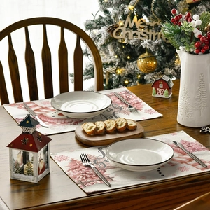Festive Christmas table mat featuring snowmen and Joy text for holiday dining decor