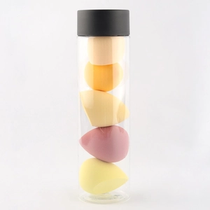Set of 5 non-latex makeup sponges in various shapes and colors with a clear storage jar
