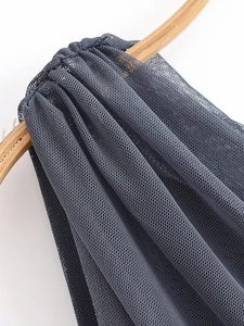Detail of dark grey mesh fabric with honeycomb texture on a wooden ring display