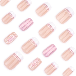 Short square press-on nails with white French tips, pink glitter, and butterfly accents