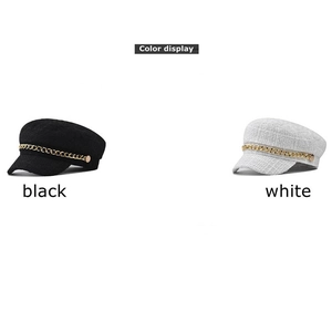 Elegant tweed newsboy caps for women in black and white with gold chain decorative accent
