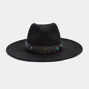 Detail of western fedora hat featuring a leather band with turquoise beads and a bull skull buckle