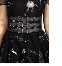 Detail of a black punk-style wide corset belt with three silver square metal buckles
