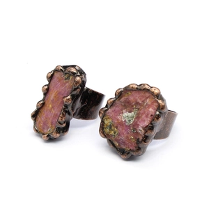 Detailed macro of vintage bronze rings with natural pink-purple druzy agate crystal stones