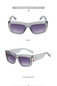 Detail view of transparent grey cat eye sunglasses with purple gradient lenses
