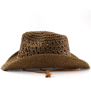 Detail of dark brown cowboy straw hat showing woven texture and adjustable chin strap