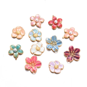Set of 11 colorful enamel flower charms with pearls and gold edges for jewelry making