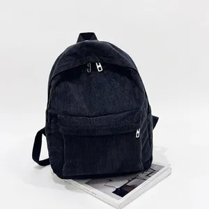 Classic black corduroy backpack for women featuring a spacious main zip pocket and adjustable straps