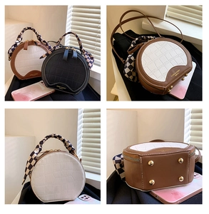 Detail view of mini round crossbody bags with crocodile texture and checkerboard silk scarf