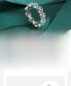 Detail of s925 silver ring with 5A cubic zirconia stones in leaf-like cluster design