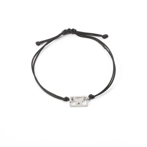 Detail of adjustable black woven rope bracelet with a silver hollow butterfly charm