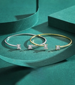 Macro shot of 925 sterling silver open bangles with emerald cut cubic zirconia gems