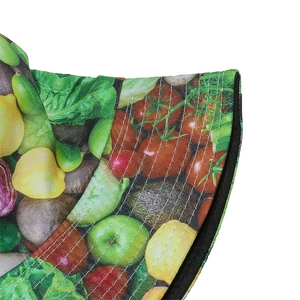Detail of vibrant fruit and vegetable print on twill cotton fisherman bucket hat