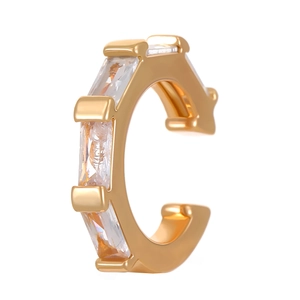 Detail of C-shaped gold ear cuff with rectangular zircon stones on white background