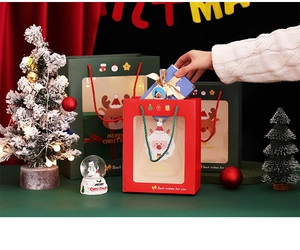 Christmas gift bags with transparent PVC window and festive Santa Claus and reindeer prints