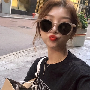 Chic tea-colored round frame sunglasses for women with gray lenses and retro design