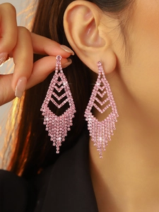 Close-up of pink rhinestone long tassel earrings showing elegant dangling geometric design