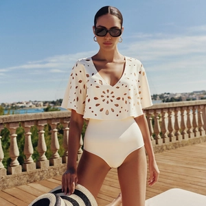 Chic cream cutout one-piece swimsuit with floral hollow patterns for beach vacation