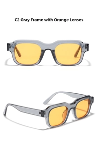 Detail view of square Y2K sunglasses with grey frames and vibrant orange lenses