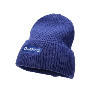 Thick navy blue ribbed knit beanie with THE FOCUS embroidery for winter warmth