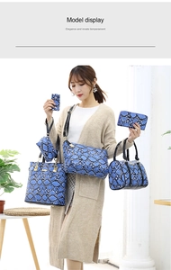 Blue snake skin pattern handbag 6-piece set displayed on model in studio