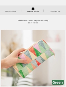 Detail of colorful geometric patchwork long wallet with textured synthetic leather and zipper