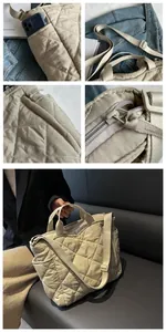 Detail view of beige quilted tote bag showing stitching and adjustable nylon strap