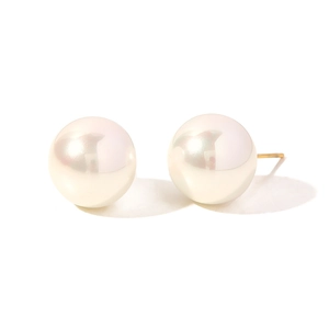 Close-up of elegant round white pearls with golden posts on a clean white background