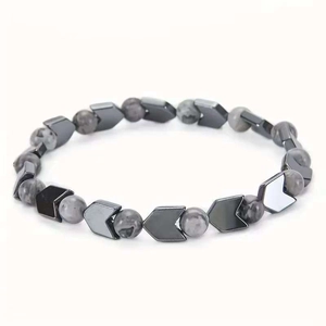 Men's Tiger Eye and Hematite beaded bracelet with arrow charms on a white background
