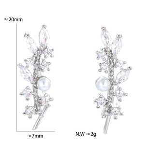 Detailed view of silver vine leaf ear cuff with pearls and zircons measuring 20mm x 7mm