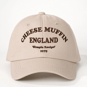 Beige cotton baseball cap featuring brown Cheese Muffin embroidery in a vintage style