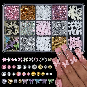Detailed view of 15-compartment nail art kit with resin bows and assorted pearls