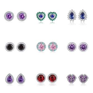 Macro detail of 925 silver stud earrings with colorful gemstones in various shapes