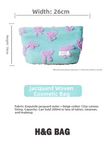 Detail view of a 26x18cm light blue jacquard makeup bag with purple floral patterns
