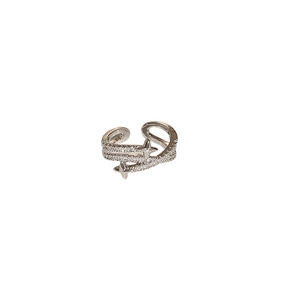 Modern silver star-shaped open ring featuring sparkling pave zircon stones in a sleek design