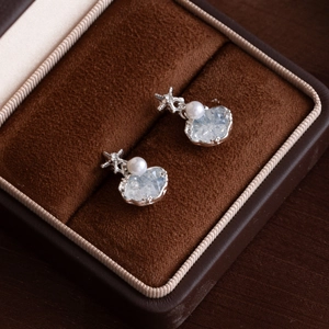 Starfish earrings with pearls and blue crystals in a velvet jewelry box
