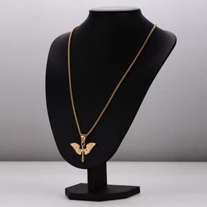 Golden stainless steel angel wings cross necklace for men on black mannequin bust