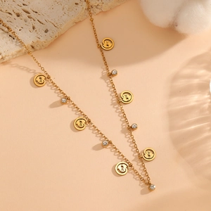 18K gold plated stainless steel necklace with LOVE engraved discs and crystal accents