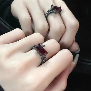 Thorn style dark vintage ring with rectangle red gemstone and black textured metal