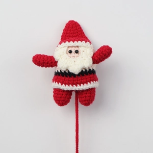 Handmade crochet Santa Claus doll ornament with festive red and white yarn for Christmas