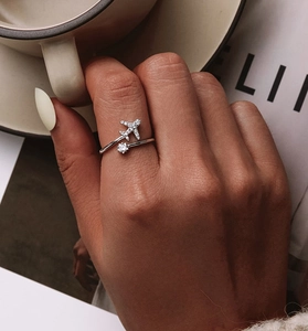 Close-up of S925 sterling silver airplane ring with sparkling zircon stones on finger