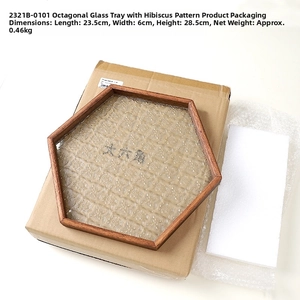 Detailed view of octagonal wood tray with embossed begonia glass and packaging info