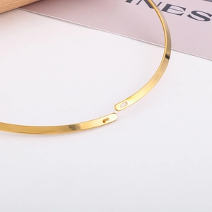 Polished gold stainless steel flat choker with minimalist ball buckle closure mechanism