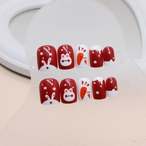 Short press-on nails with red and white rabbit designs for New Year festive manicure