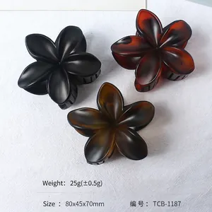 Three-piece frosted flower hair claw clips in black and amber colors, 80x45x70mm size