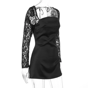 Detail of elegant black lace long sleeves and satin fabric texture on the A-line dress