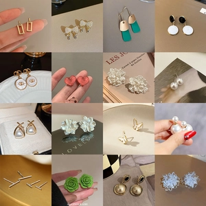 Collection of floral, heart, and pearl stud earrings in various gold and colorful designs