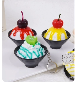 Detailed view of four fake fruit smoothie bowl keychains with assorted fruit toppings