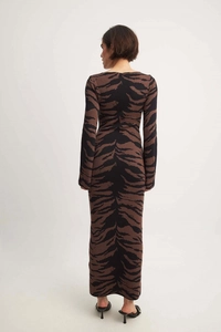 Detail of tiger print knitted long sleeve maxi dress showing slim fit back profile